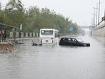 Vehicles stuck on a waterlogged road on the National Highway 24, near Vinod Nagar in East Delhi, on Friday. (Ajay Aggarwal/HT Photo) Vehicles stuck on a waterlogged road on the National Highway 24, near Vinod Nagar in East Delhi, on Friday. (Ajay Aggarwal/HT Photo)