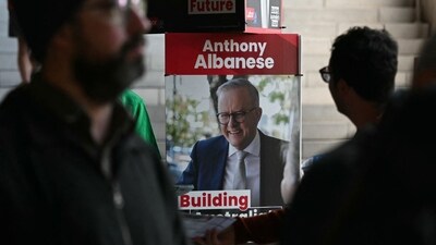 A poster of Australia's Prime Minister Anthony Albanese is displayed as people wait to vote in Australia's general election at a polling station in the suburb of Marrickville in Sydney on May 3, 2025. Australians started voting on May 3 in a bitterly contested general election, deciding a contest shaped by living costs, climate anxiety and Trump tariffs. (AFP) A poster of Australia's Prime Minister Anthony Albanese is displayed as people wait to vote in Australia's general election at a polling station in the suburb of Marrickville in Sydney on May 3, 2025. Australians started voting on May 3 in a bitterly contested general election, deciding a contest shaped by living costs, climate anxiety and Trump tariffs. (AFP)