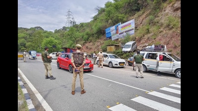 Jammu and Kashmir police personnel check vehicles at the Phalata Naka point on National Highway 1, in Udhampur on Saturday. (ANI Photo) Jammu and Kashmir police personnel check vehicles at the Phalata Naka point on National Highway 1, in Udhampur on Saturday. (ANI Photo)