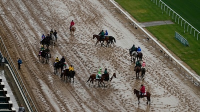 Horses prepare for a race on a muddy track at Churchill Downs before the 151st running of the Kentucky Derby horse race Saturday, May 3, 2025, in Louisville, Ky. (AP Photo/Charlie Riedel) (AP) Horses prepare for a race on a muddy track at Churchill Downs before the 151st running of the Kentucky Derby horse race Saturday, May 3, 2025, in Louisville, Ky. (AP Photo/Charlie Riedel) (AP)