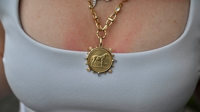A person wears a horse necklace at Churchill Downs before the 151st running of the Kentucky Derby horse race Saturday, May 3, 2025, in Louisville, Ky. (AP Photo/Jon Cherry) (AP) A person wears a horse necklace at Churchill Downs before the 151st running of the Kentucky Derby horse race Saturday, May 3, 2025, in Louisville, Ky. (AP Photo/Jon Cherry) (AP)