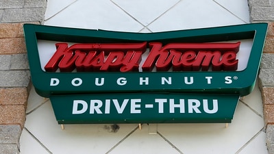 To celebrate the REAL ID compliance deadline, Krispy Kreme is giving away free doughnuts on May 7 to brighten DMV visits. (AP Photo/Alan Diaz, File) (AP) To celebrate the REAL ID compliance deadline, Krispy Kreme is giving away free doughnuts on May 7 to brighten DMV visits. (AP Photo/Alan Diaz, File) (AP)