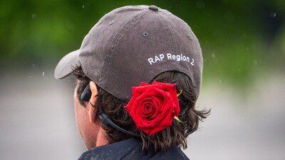 A track worker wears a rose in his hat at the 2025 Kentucky Derby at Churchill Downs in Louisville, Kentucky.  Mandatory Credit: Sam Upshaw Jr/USA TODAY NETWORK via Imagn Images (IMAGN IMAGES via Reuters Connect)