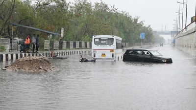Vehicles stuck on a waterlogged road on the National Highway 24, near Vinod Nagar in East Delhi, on Friday. (Ajay Aggarwal/HT Photo) Vehicles stuck on a waterlogged road on the National Highway 24, near Vinod Nagar in East Delhi, on Friday. (Ajay Aggarwal/HT Photo)