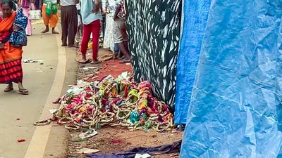 Belongings of the people scattered on the road after a stampede occurred at the Lairai Devi temple, in Shrigao, Goa, on Saturday. (ANI) Belongings of the people scattered on the road after a stampede occurred at the Lairai Devi temple, in Shrigao, Goa, on Saturday. (ANI)