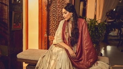 Actor Sonam A Kapoor wears a red-and-white Gulab Ghaghra from Ateev Anand. Made with recycled cotton, it features an intricate gold border and pitta work along the hem Actor Sonam A Kapoor wears a red-and-white Gulab Ghaghra from Ateev Anand. Made with recycled cotton, it features an intricate gold border and pitta work along the hem