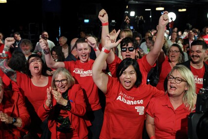 Supporters of Australia's Prime Minister Anthony Albanese react at a Labor party election night event, after local media projected the Labor Party's victory, on the day of the Australian federal election, in Sydney, Australia, May 3, 2025. (Reuters)