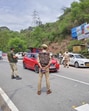 Jammu and Kashmir police personnel check vehicles at the Phalata Naka point on National Highway 1, in Udhampur on Saturday. (ANI Photo) Jammu and Kashmir police personnel check vehicles at the Phalata Naka point on National Highway 1, in Udhampur on Saturday. (ANI Photo)