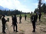 Security personnel inspect the site in the aftermath of an attack as food stall chairs lie empty in Pahalgam. Security personnel inspect the site in the aftermath of an attack as food stall chairs lie empty in Pahalgam.