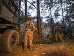 Security personnel keep vigil during a search operation after an army vehicle came under fire from suspected terrorists in a forward village near the Line of Control, in Jammu and Kashmir's Rajouri district. Security personnel keep vigil during a search operation after an army vehicle came under fire from suspected terrorists in a forward village near the Line of Control, in Jammu and Kashmir's Rajouri district.