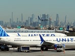 United Airlines planes land and prepare to take off at Newark Liberty International Airport in Newark, New Jersey, U.S., January 27, 2025. REUTERS/Fabrizio Bensch/File Photo
