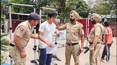 A student being frisked before appearing for the National Eligibility-cum-Entrance Test (NEET) - UG exam at GMSSS, Sector 22, on Sunday. (Keshav Singh/HT) A student being frisked before appearing for the National Eligibility-cum-Entrance Test (NEET) - UG exam at GMSSS, Sector 22, on Sunday. (Keshav Singh/HT)