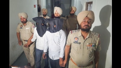 After being arrested, Pakistani spies in custody of Punjab Police in Amritsar on Sunday. (Sameer Sehgal/Hindustan Times) After being arrested, Pakistani spies in custody of Punjab Police in Amritsar on Sunday. (Sameer Sehgal/Hindustan Times)