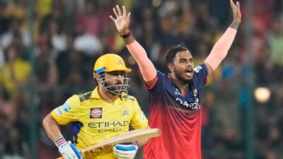 Yash Dayal, right, appeals successfully for the wicket of CSK captain Mahendra Singh Dhoni, left, during the IPL match at Chinnaswamy Stadium (AP) Yash Dayal, right, appeals successfully for the wicket of CSK captain Mahendra Singh Dhoni, left, during the IPL match at Chinnaswamy Stadium (AP)