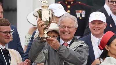 Trainer William Mott celebrates with the trophy after Sovereignty #18, ridden by jockey Junior Alvarado won the 151st running of the Kentucky Derby at Churchill Downs. (AFP) Trainer William Mott celebrates with the trophy after Sovereignty #18, ridden by jockey Junior Alvarado won the 151st running of the Kentucky Derby at Churchill Downs. (AFP)