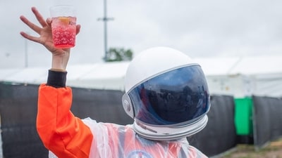 An attendee danced in the infield, dressed as an astronaut, during the 151st running of the Kentucky Derby at Churchill Downs in Louisville, Kentucky. (Leandro Lozada/AFP) An attendee danced in the infield, dressed as an astronaut, during the 151st running of the Kentucky Derby at Churchill Downs in Louisville, Kentucky. (Leandro Lozada/AFP)