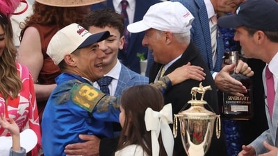 Trainer William Mott celebrates with jockey Junior Alvarado in winners circle after Sovereignty #18 won the 151st running of the Kentucky Derby. (AFP) Trainer William Mott celebrates with jockey Junior Alvarado in winners circle after Sovereignty #18 won the 151st running of the Kentucky Derby. (AFP)