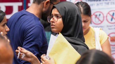 An aspirant outside an examination centre as she arrives to appear for the NEET UG exam 2025, in New Delhi, Sunday, May 4, 2025. (PTI) An aspirant outside an examination centre as she arrives to appear for the NEET UG exam 2025, in New Delhi, Sunday, May 4, 2025. (PTI)