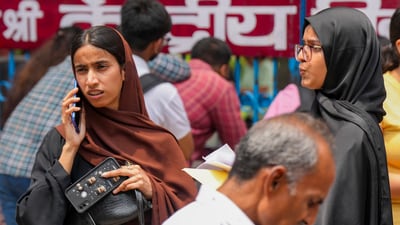 An aspirant talks on mobile phone as she arrives to appear for the NEET UG exam 2025, in New Delhi, Sunday, May 4, 2025. (PTI) An aspirant talks on mobile phone as she arrives to appear for the NEET UG exam 2025, in New Delhi, Sunday, May 4, 2025. (PTI)