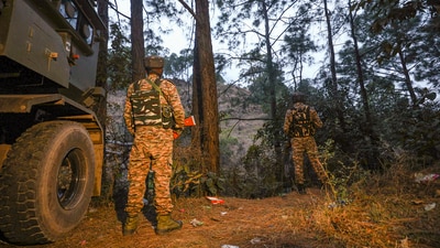 Security personnel keep vigil during a search operation after an army vehicle came under fire from suspected terrorists in a forward village near the Line of Control, in Jammu and Kashmir's Rajouri district. (PTI file) Security personnel keep vigil during a search operation after an army vehicle came under fire from suspected terrorists in a forward village near the Line of Control, in Jammu and Kashmir's Rajouri district. (PTI file)