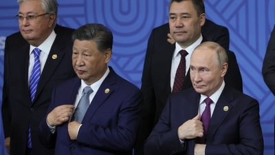 Chinese President Xi Jinping, left, and Russian President Vladimir Putin attend a group photo ceremony prior to Outreach/BRICS Plus format session at the BRICS Summit in Kazan, Russia, Oct. 24, 2024. (AP)