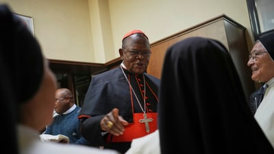 Cardinal Fridolin Ambongo Besungu celebrates Mass at his titular church, San Gabriele Arcangelo all'Acqua Traversa three days before the conclave to elect the 267th pope of the Roman Catholic Church, in Rome, Sunday, May 4, 2025. (AP Photo/Andrew Medichini) (AP) Cardinal Fridolin Ambongo Besungu celebrates Mass at his titular church, San Gabriele Arcangelo all'Acqua Traversa three days before the conclave to elect the 267th pope of the Roman Catholic Church, in Rome, Sunday, May 4, 2025. (AP Photo/Andrew Medichini) (AP)