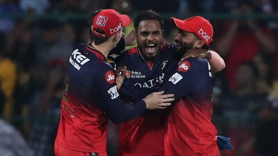 RCB's Yash Dayal celebrates with teammates after bowling the last ball to win the match against CSK. (REUTERS)
