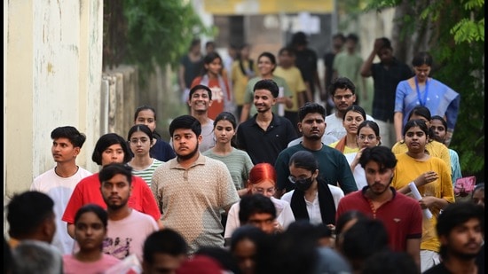 Candidates coming out of a centre in Lucknow on Sunday. (Deepak Gupta/HT photo)