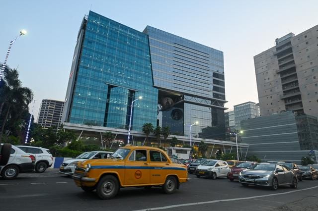 A glass-and-steel tower, now common across many Indian cities, stands in Salt Lake Sector V in Kolkata, which has emerged as an IT hub. (Samir Jana/HT photo)