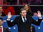 Barron Trump gestures after being acknowledged by his father US President Donald Trump during the inaugural parade inside Capital One Arena, in Washington, DC, on January 20, 2025. Barron Trump gestures after being acknowledged by his father US President Donald Trump during the inaugural parade inside Capital One Arena, in Washington, DC, on January 20, 2025.