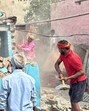 The illegal structure being demolished in the presence of police and MC officials in Ludhiana on Tuesday. (HT Photo)