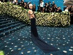 Emma Chamberlain poses during the Met Gala, an annual fundraising gala held for the benefit of the Metropolitan Museum of Art's Costume Institute with this year's theme 'Superfine: Tailoring Black Style,' in New York City, New York, U.S., May 5, 2025. 