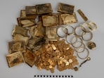 The hiker found two boxes full of find gold coins, bracelets, and cigarette cases weighing a total of 6.8 kg.