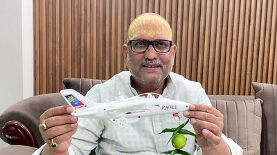 Uttar Pradesh Congress President Ajay Rai while speaking to media shows a 'toy plane' with Rafale written on it and lemon-chillies hanging in it, in Varanasi on Sunday. (ANI) Uttar Pradesh Congress President Ajay Rai while speaking to media shows a 'toy plane' with Rafale written on it and lemon-chillies hanging in it, in Varanasi on Sunday. (ANI)