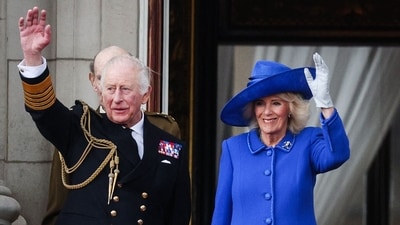 King Charles III and Queen Camilla waved to gathered crowds from the balcony of Buckingham Palace on May 5, 2025. (Photo by Adrian DENNIS / AFP) (AFP) King Charles III and Queen Camilla waved to gathered crowds from the balcony of Buckingham Palace on May 5, 2025. (Photo by Adrian DENNIS / AFP) (AFP)