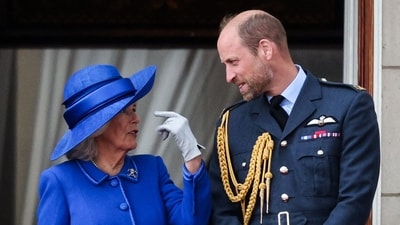 Queen Camilla was seen speaking with Prince William on the balcony of Buckingham Palace on May 5, 2025, following the armed forces procession held to commemorate the 80th anniversary of VE Day. (Photo by Adrian DENNIS / AFP) (AFP) Queen Camilla was seen speaking with Prince William on the balcony of Buckingham Palace on May 5, 2025, following the armed forces procession held to commemorate the 80th anniversary of VE Day. (Photo by Adrian DENNIS / AFP) (AFP)