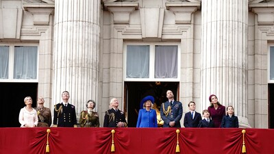 The royal family looks up while the Red Arrows fly past Buckingham Palace. (AP) The royal family looks up while the Red Arrows fly past Buckingham Palace. (AP)