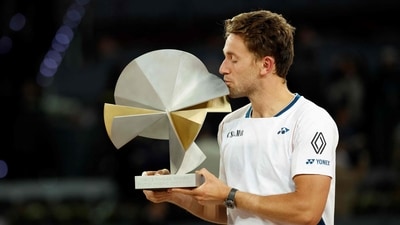 Casper Ruud kisses his trophy on the podium after winning Jack Draper during their 2025 ATP Tour Madrid Open tennis tournament singles final match (AFP) Casper Ruud kisses his trophy on the podium after winning Jack Draper during their 2025 ATP Tour Madrid Open tennis tournament singles final match (AFP)
