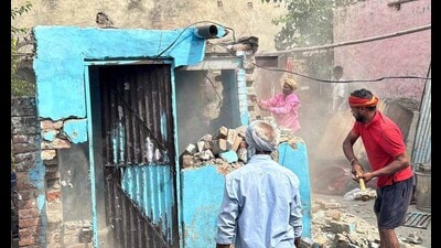 The illegal structure being demolished in the presence of police and MC officials in Ludhiana on Tuesday. (HT Photo) The illegal structure being demolished in the presence of police and MC officials in Ludhiana on Tuesday. (HT Photo)