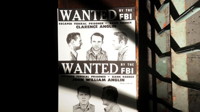 This is a copy of John and Clarence Anglin's wanted poster rests outside a medical cell on Alcatraz Island on Monday, June 11, 2012, in the San Francisco Bay. The brothers, along with fellow inmate Frank Morris, escaped from the federal prison on June 11, 1962. REUTERS/Noah Berger/File Photo (REUTERS)