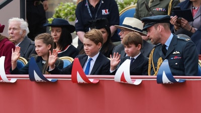 Princess Charlotte, Prince George, Prince Louis and William waves to the crowd from Buckingham Palace balcony during the VE Day flypast commemorations. (REUTERS)