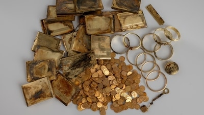 The hiker found two boxes full of find gold coins, bracelets, and cigarette cases weighing a total of 6.8 kg. (Facebook/muzeumhk.cz) The hiker found two boxes full of find gold coins, bracelets, and cigarette cases weighing a total of 6.8 kg. (Facebook/muzeumhk.cz)
