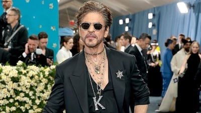 Shah Rukh Khan stunned at the Met Gala 2025, sporting a walking stick. Shah Rukh Khan stunned at the Met Gala 2025, sporting a walking stick.