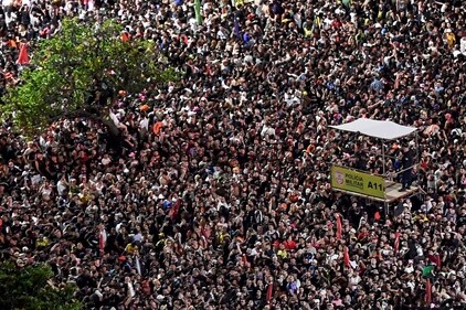 Military Police officers stand on an elevated platform as fans wait for the beginning of the free mega-concert of US pop star Lady Gaga at Copacabana beach in Rio de Janeiro, Brazil, on May 3, 2025. Brazilian police said Sunday they had arrested two people in connection with a foiled plot to attack Lady Gaga's packed mega-concert in Rio de Janeiro. (Photo by Daniel RAMALHO / AFP) (AFP) Military Police officers stand on an elevated platform as fans wait for the beginning of the free mega-concert of US pop star Lady Gaga at Copacabana beach in Rio de Janeiro, Brazil, on May 3, 2025. Brazilian police said Sunday they had arrested two people in connection with a foiled plot to attack Lady Gaga's packed mega-concert in Rio de Janeiro. (Photo by Daniel RAMALHO / AFP) (AFP)