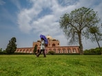 People enjoy the pleasant weather under the sky at Humayun's Tomb in New Delhi on Saturday. People enjoy the pleasant weather under the sky at Humayun's Tomb in New Delhi on Saturday.