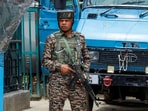 An Indian security force personnel stands guard on a street, following the Pahalgam attack in Kashmir.