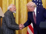 US President Donald Trump and Prime Minister Narendra Modi shake hands as they attend a joint press conference at the White House in Washington, D.C., U.S., February 13, 2025. 