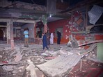 Local residents and members of media examine a building damaged by a missile strike near Muzaffarabad in Pakistan-controlled Kashmir, on Wednesday, May 7. Local residents and members of media examine a building damaged by a missile strike near Muzaffarabad in Pakistan-controlled Kashmir, on Wednesday, May 7.