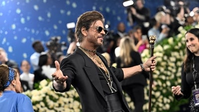 Shah Rukh Khan made his Met Gala debut, striking his signature pose on the blue carpet ahead of the opening of the "Superfine: Tailoring Black Style" exhibition on Monday, May 5, 2025, in New York. AP/PTI (AP) Shah Rukh Khan made his Met Gala debut, striking his signature pose on the blue carpet ahead of the opening of the "Superfine: Tailoring Black Style" exhibition on Monday, May 5, 2025, in New York. AP/PTI (AP)