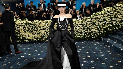The crown on top of BLACKPINK's Jennie's Chanel-dressed ensemble was this flat top hat. (Evan Agostini/Invision/AP)